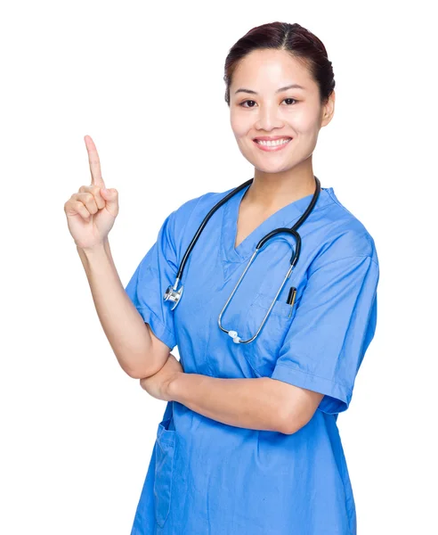 Médecin féminin avec doigt pointant vers le haut — Photo