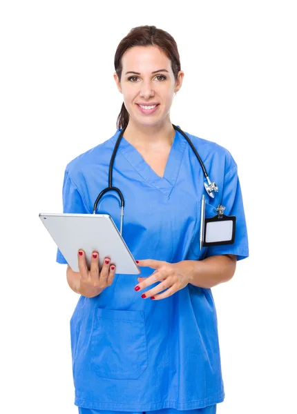 Female doctor using tablet Stock Photo
