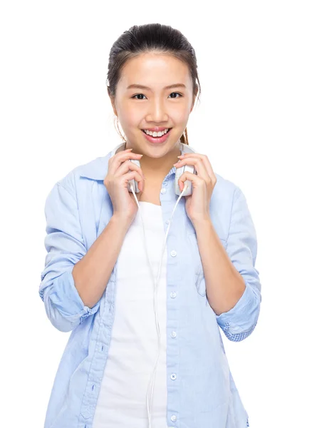 Woman put headphone on shoulder — Stock Photo, Image