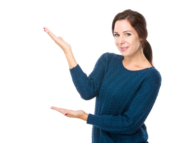 Brunette woman present with hand — Stock Photo, Image