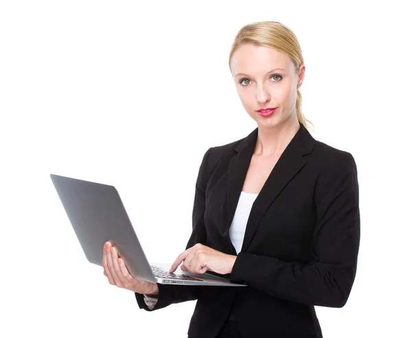 Businesswoman using laptop — Stock Photo, Image