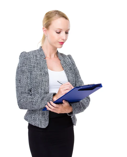 Businesswoman write on clipboard — Stock Photo, Image