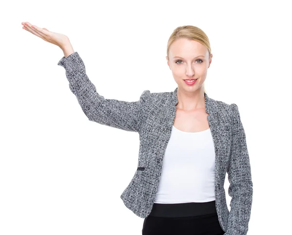 Caucasian businesswoman present with hand — Stock Photo, Image