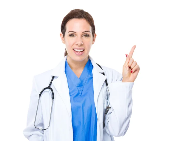 Médecin féminin avec doigt pointant vers le haut — Photo