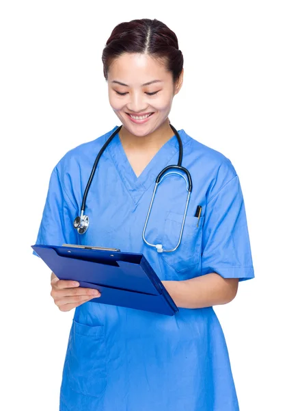 Female doctor write on clipboard — Stock Photo, Image