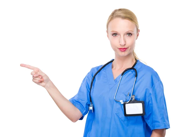 Doctor with finger point aside — Stock Photo, Image