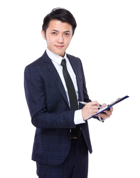 Businessman write on clipboard — Stock Photo, Image