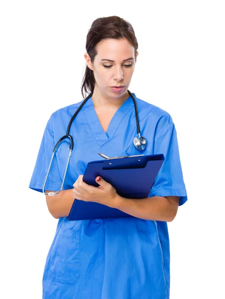 Female doctor write on clipboard — Stock Photo, Image