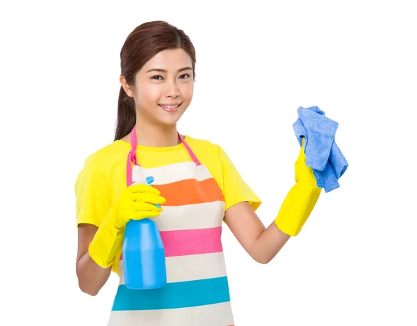 Housewife using spray and towel — Stock Photo, Image