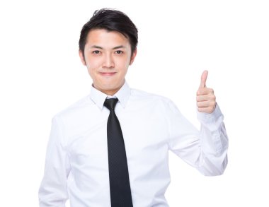 Baş parmağı havada bir iş adamı.