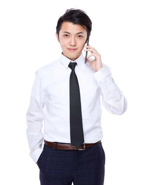 Businessman talking on mobile phone — Stock Photo, Image