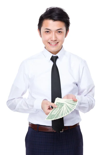Podnikatel drží mnoho amerických bankovek — Stock fotografie