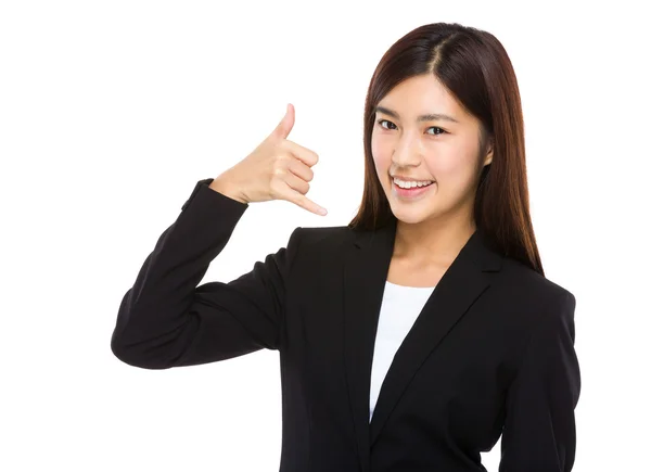 Businesswoman with call me gesture — Stock Photo, Image
