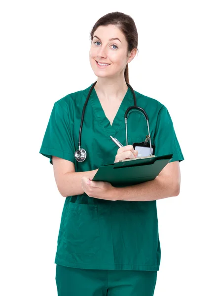 Female doctor write on clipboard Stock Image