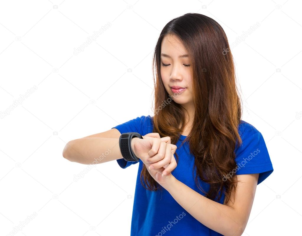 Woman looking at wearable watch