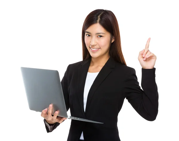 Businesswoman with laptop and finger up — Stock Photo, Image