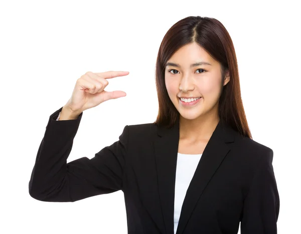 Businesswoman with small thing on hand — Stock Photo, Image