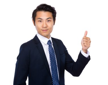 Baş parmağı havada bir iş adamı.