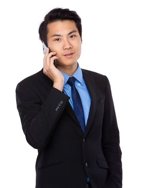 Businessman talking on mobile phone — Stock Photo, Image