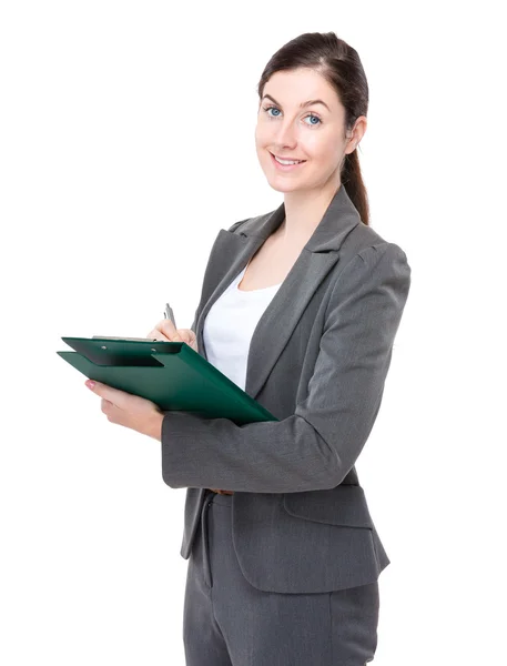 Businesswoman write on clipbaord — Stock Photo, Image