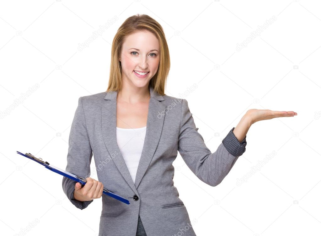 Businesswoman with clipboard and hand present