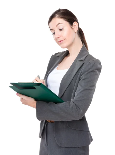 Businesswoman write on clipboard — Stock Photo, Image