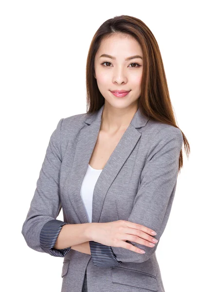 Young businesswoman with arms crossed — Stock Photo, Image