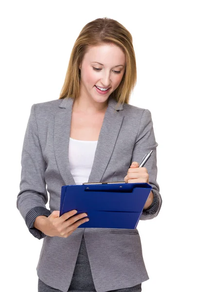 Businesswoman write on clipboard — Stock Photo, Image