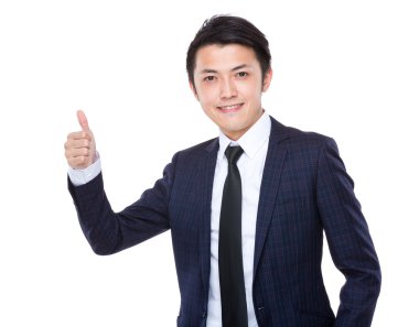 Baş parmağı havada bir iş adamı.