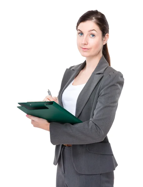 Caucasian businesswoman with clipboard — Stock Photo, Image