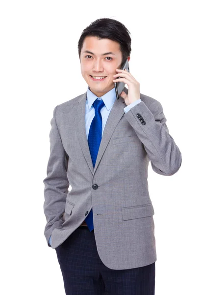 Businessman talking on cellphone — Stock Photo, Image