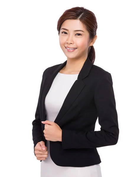 Businesswoman with hands on collar — Stock Photo, Image