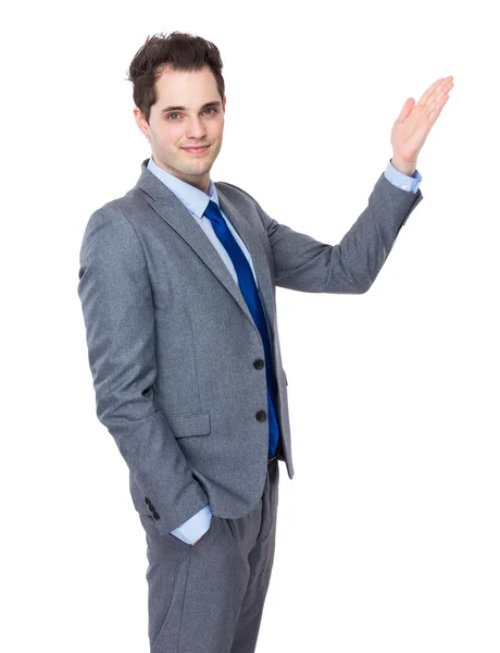 Businessman with hand presentation — Stock Photo, Image