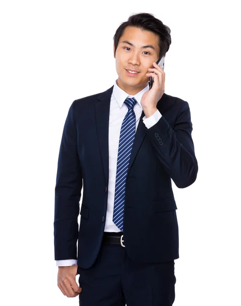 Businessman talking on mobile phone — Stock Photo, Image