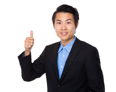 Baş parmağı havada bir iş adamı.