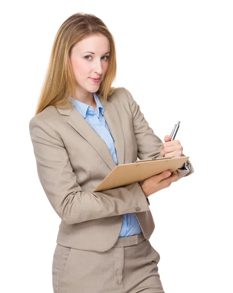 Businesswoman write on clipboard — Stock Photo, Image