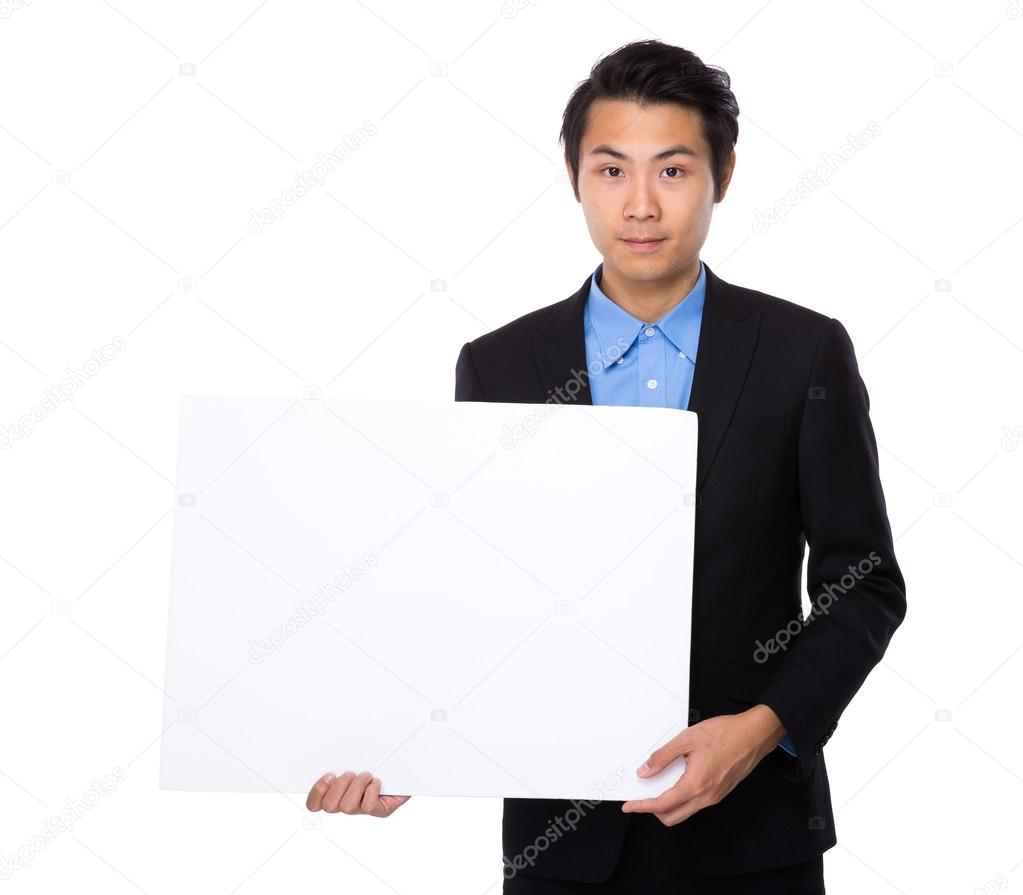 Businessman with white board