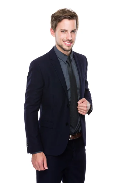 Confident businessman holding collar — Stock Photo, Image