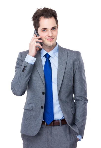 Businessman talking on mobile phone — Stock Photo, Image