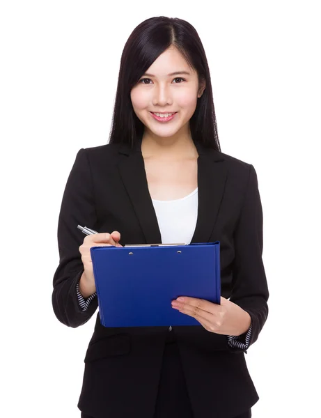 Young businesswoman with clipboard — Stock Photo, Image