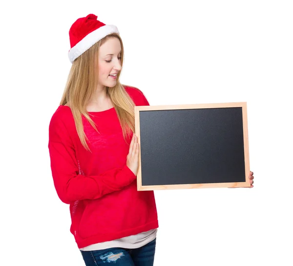 Girl in Christmas hat with sign — Stock Photo, Image
