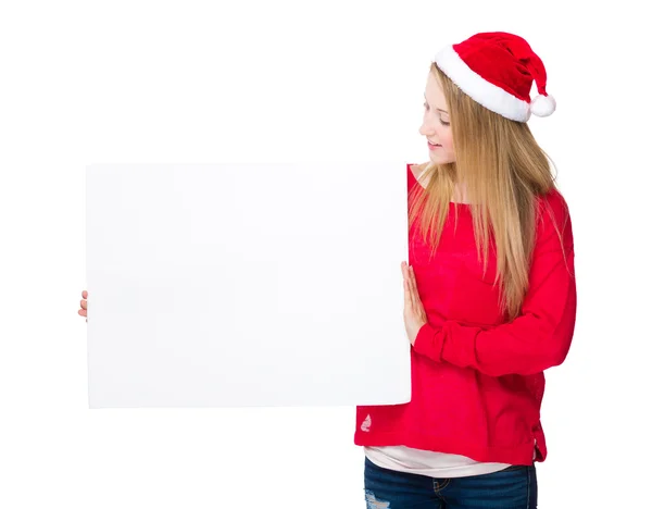Mädchen mit Weihnachtsmütze mit Schild — Stockfoto