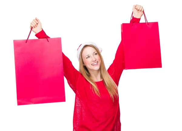 Girl in Christmas hat with bags — Stock Photo, Image