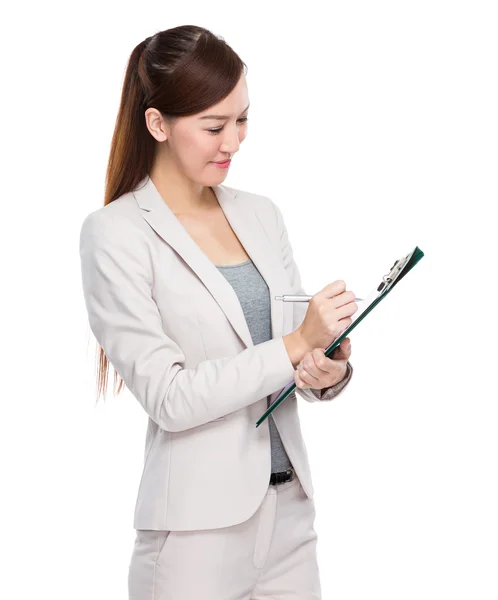 Young businesswoman with clipboard — Stock Photo, Image