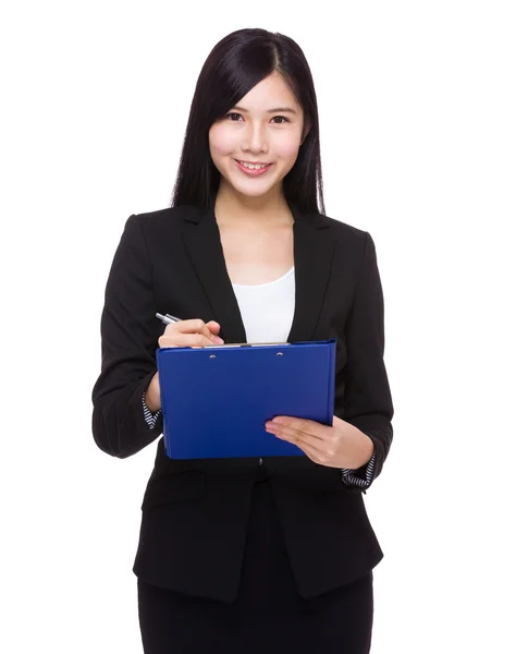 Young businesswoman with clipboard — Stock Photo, Image