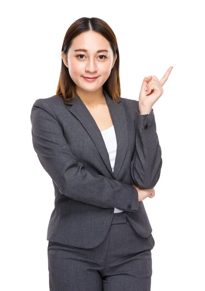 Businesswoman with finger point aside — Stock Photo, Image