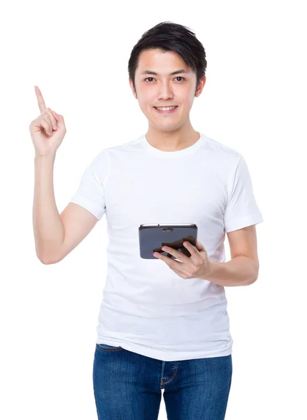 Man with tablet and finger point up — Stock Photo, Image