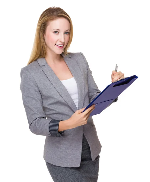 Businesswoman write on clipboard — Stock Photo, Image