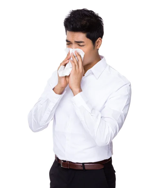 Joven empresario estornudando —  Fotos de Stock