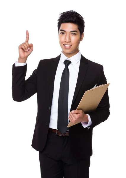 Businessman with clipboard and finger point up — Stock Photo, Image